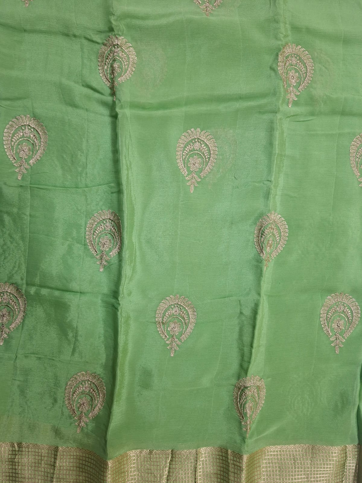 pastel green georgette crape with motif saree