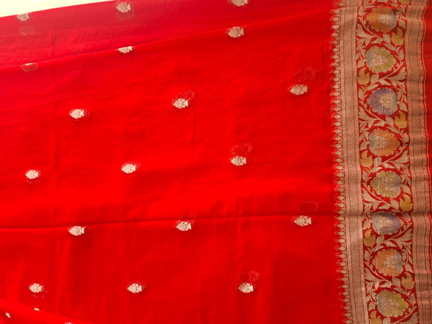 red semi chiffon meenakari border saree