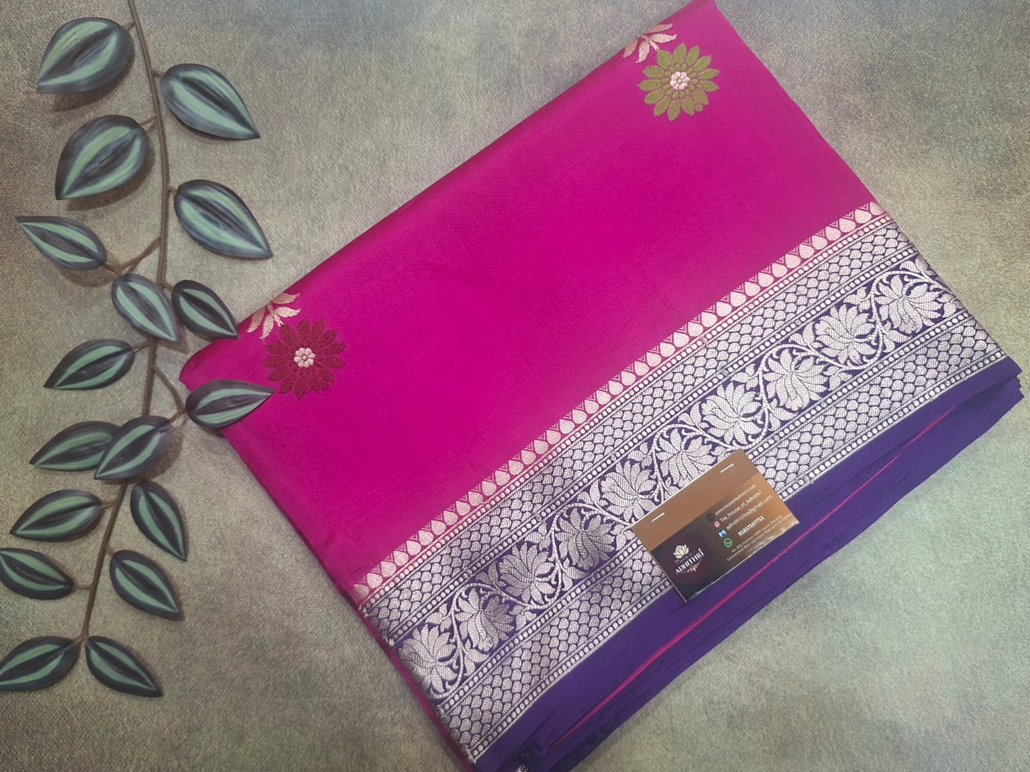 Purple and pink fabric with floral patterns on a textured surface