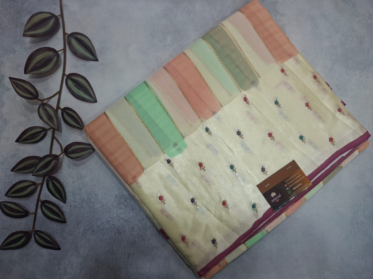 Colorful fabric with embroidery on a textured surface