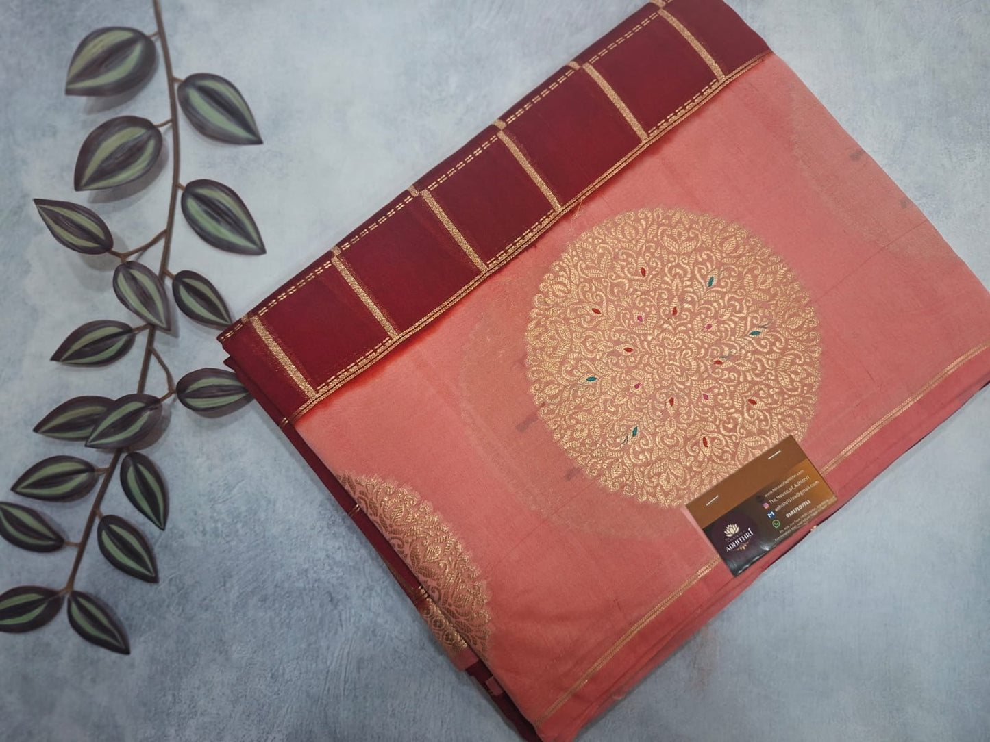 Decorative book with gold embossed design on a gray surface