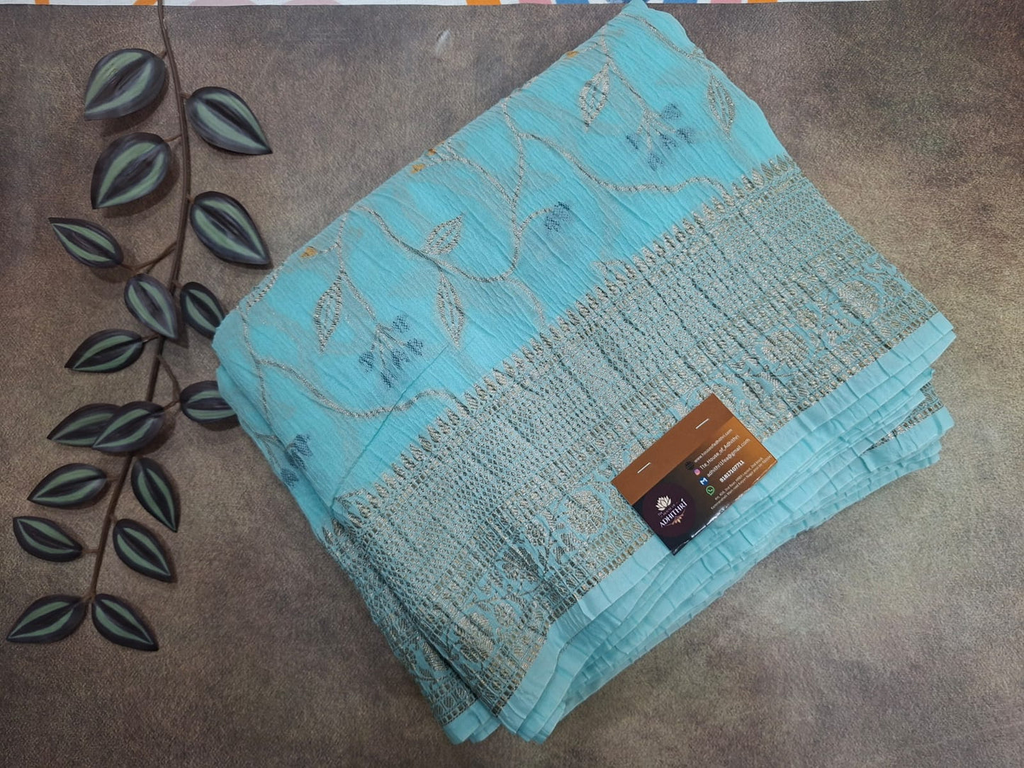Turquoise fabric with a pattern on a brown surface