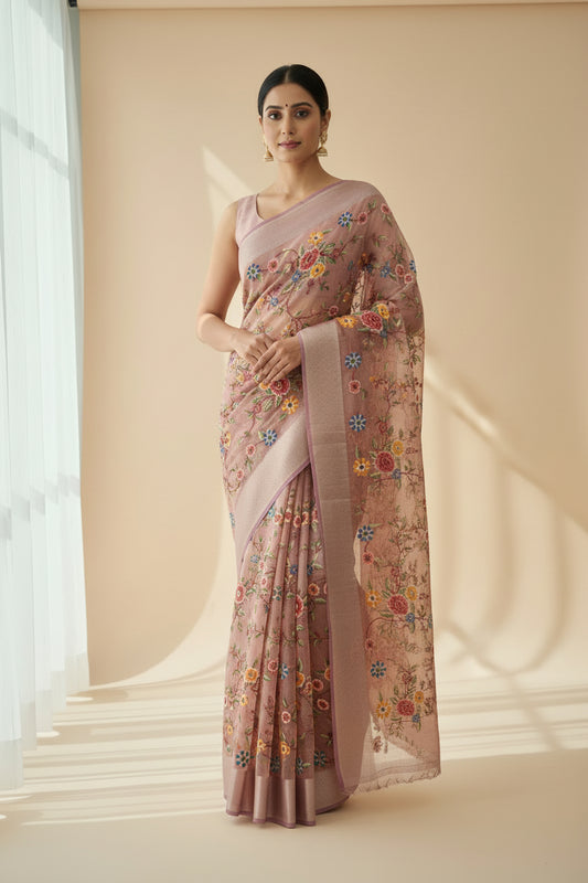 Embroidered fabric with floral patterns on a plain background