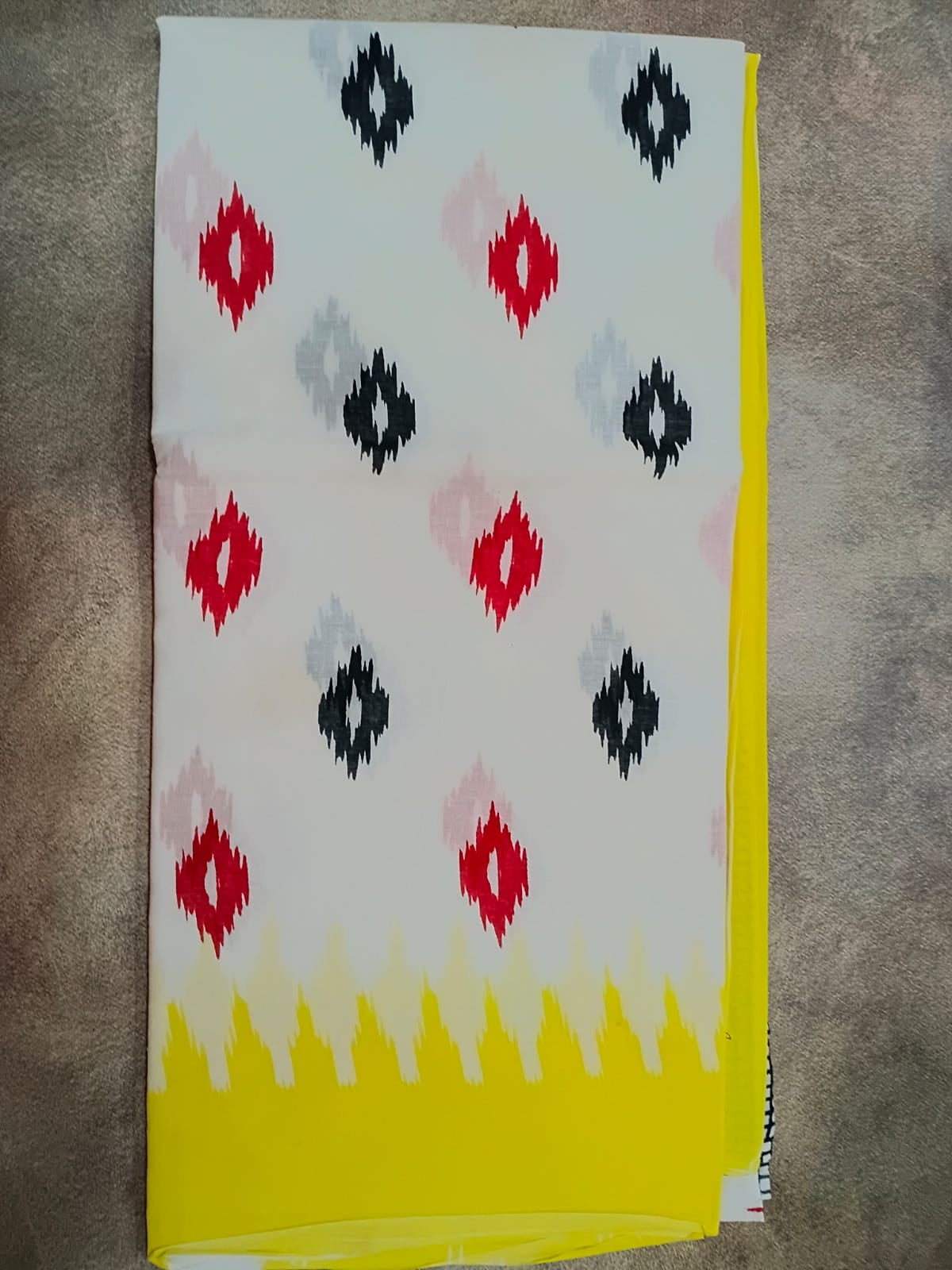 Fabric with geometric pattern on a textured surface