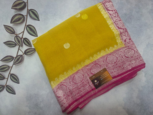 Yellow and pink saree with a floral pattern on a white background