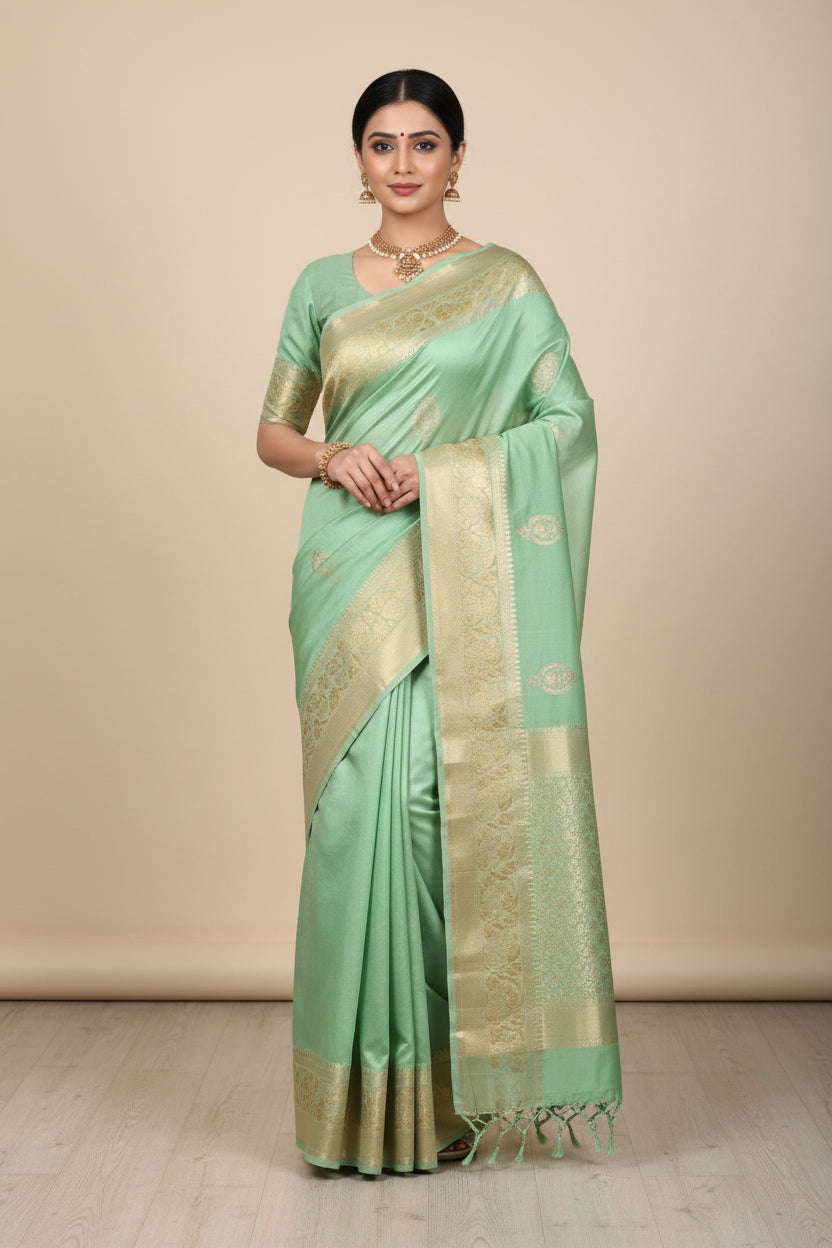 Green fabric with embroidery on a textured surface