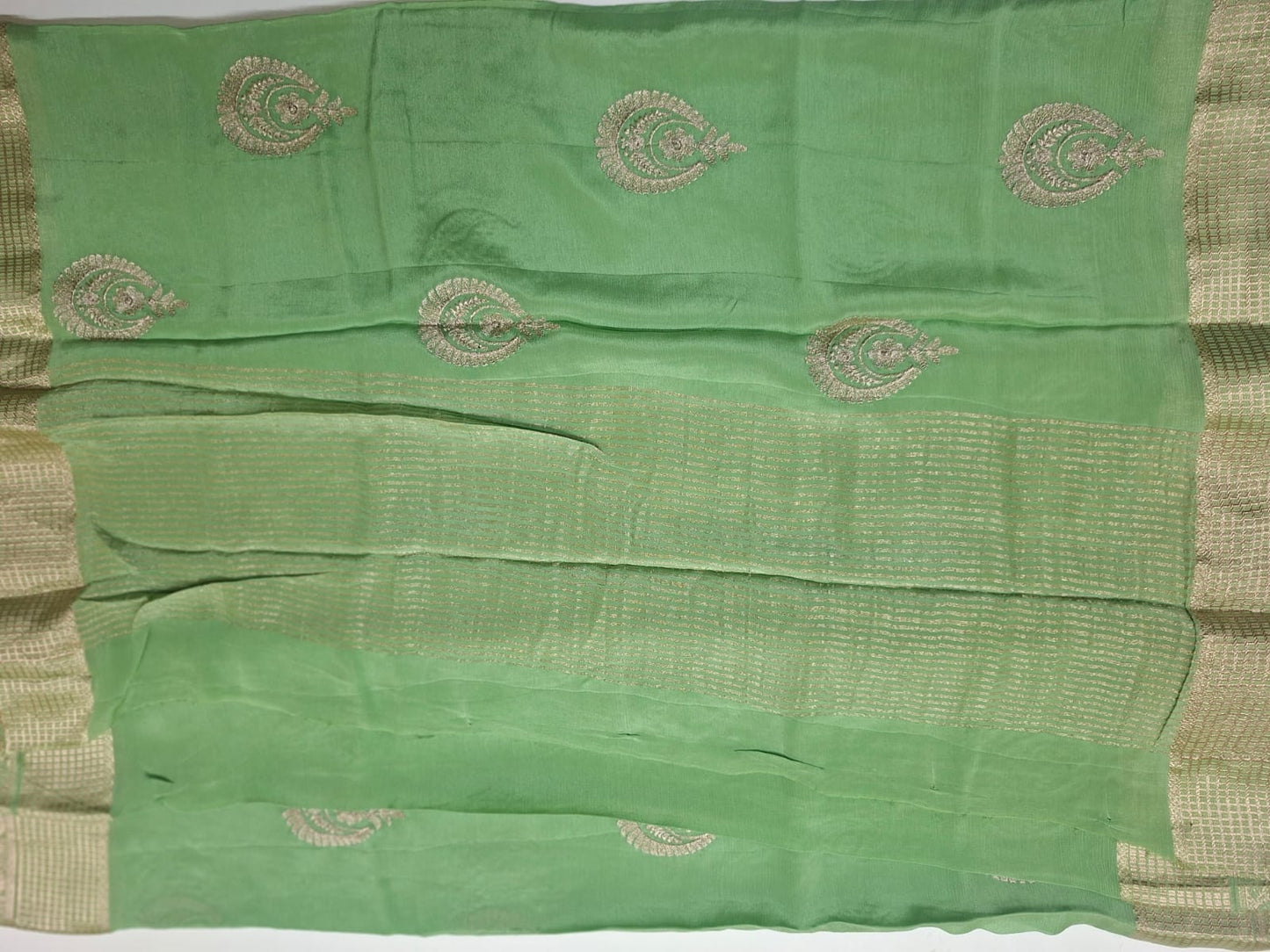 pastel green georgette  crape with motif saree