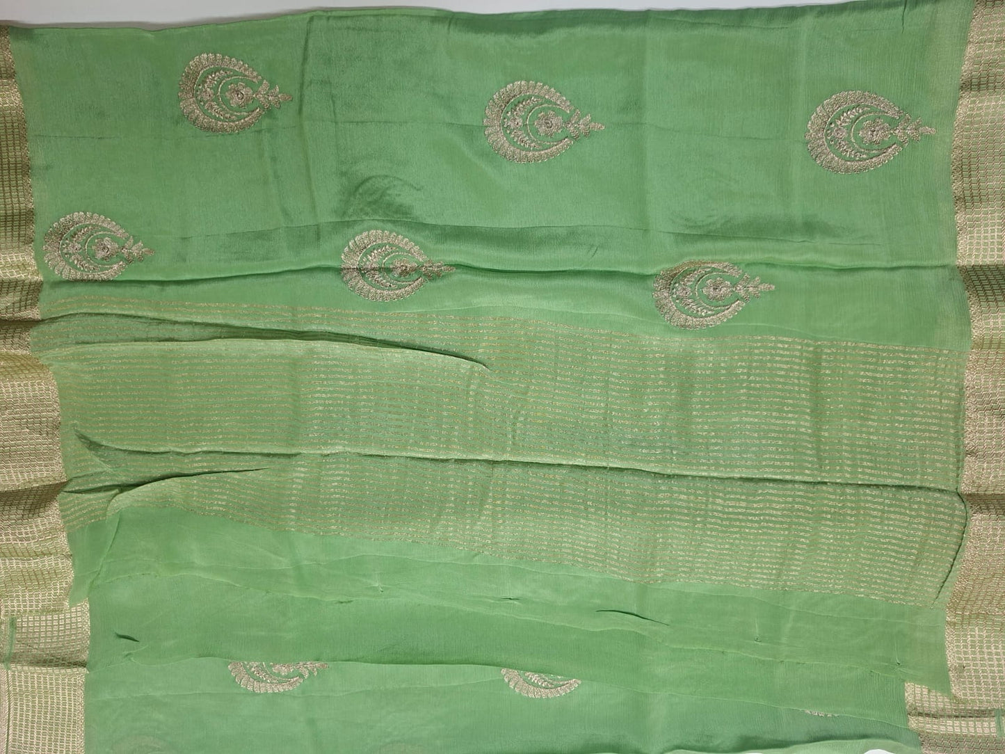 pastel green georgette  crape with motif saree