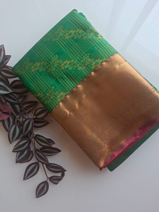 green semi silk saree with kanchi border