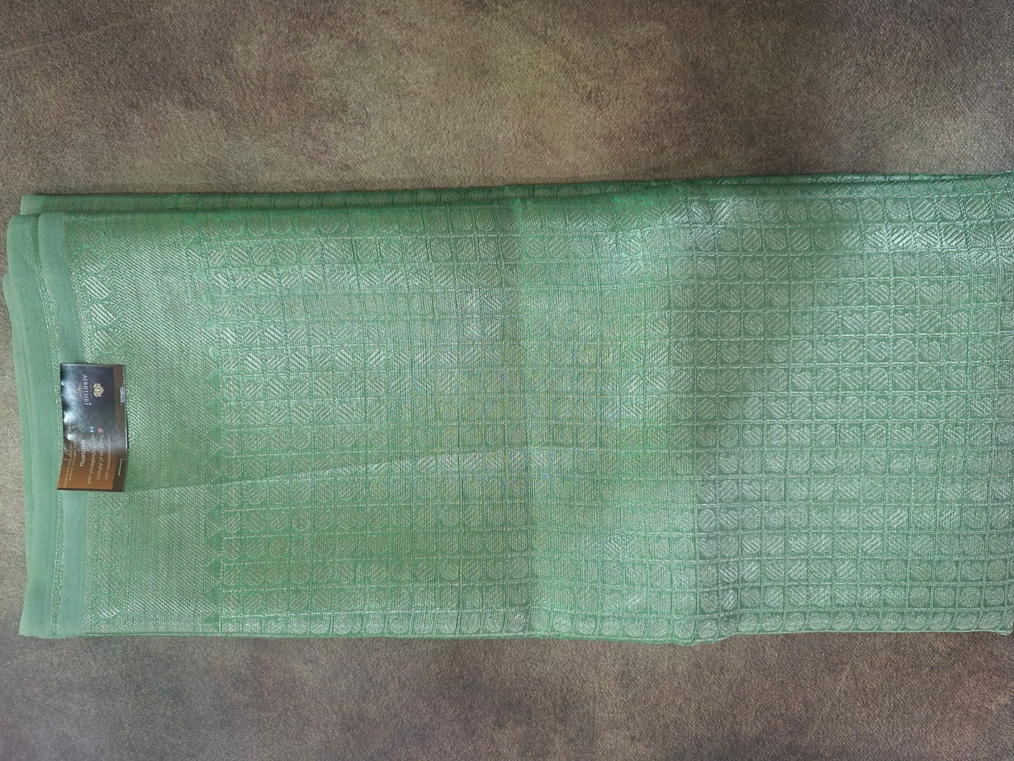 green tissue with brocade saree