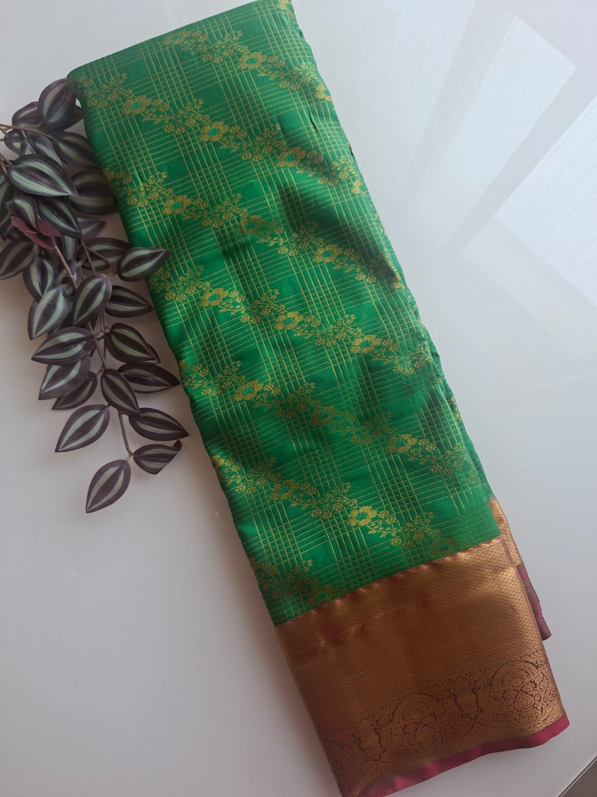 green semi silk saree with kanchi border