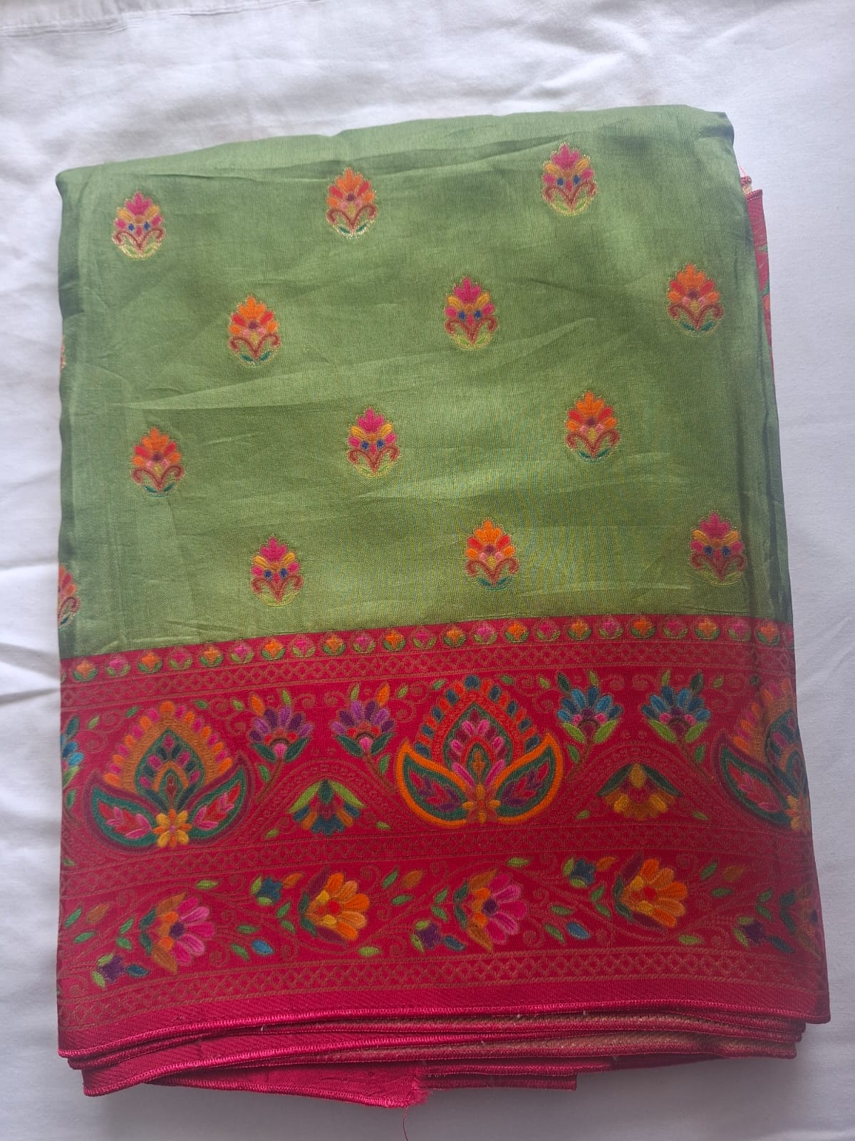 green in red satin crape pashimna saree