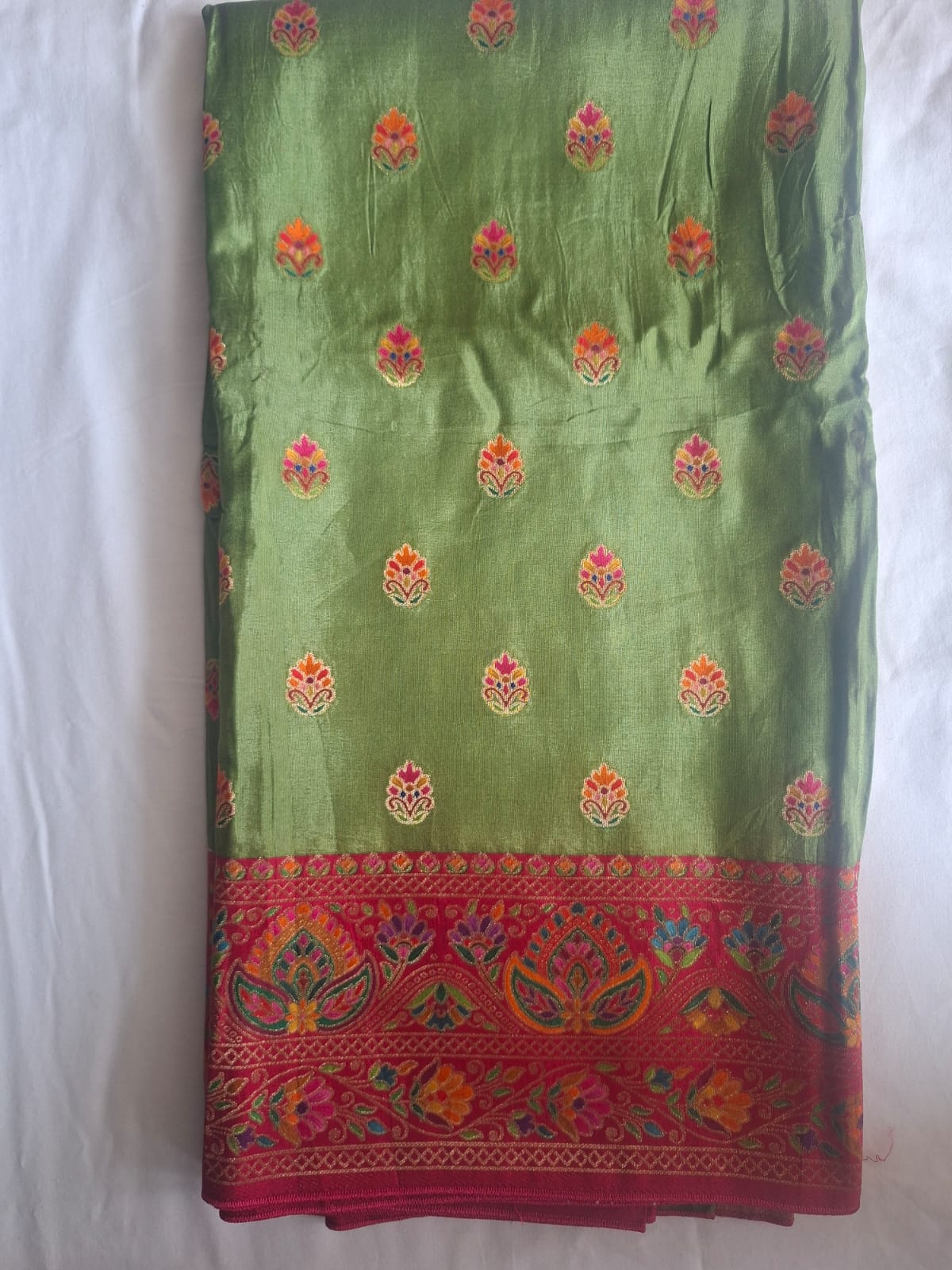 green in red satin crape pashimna saree