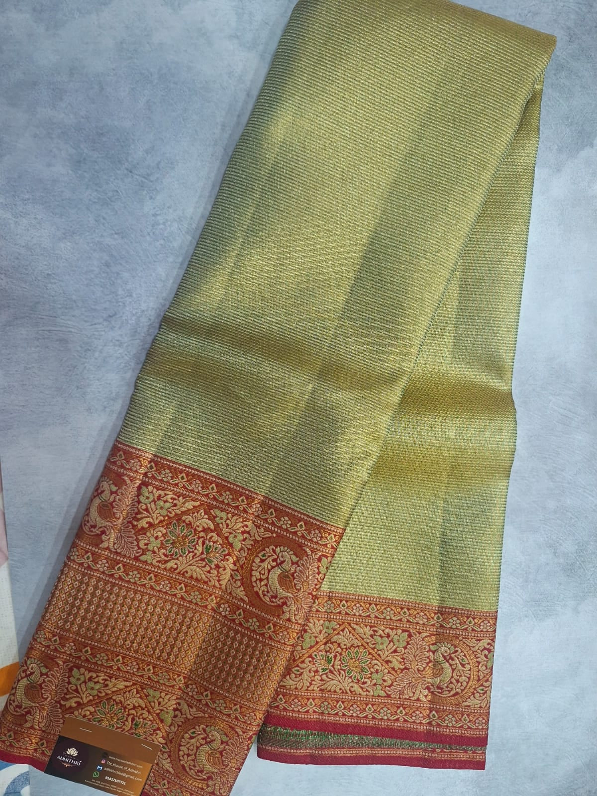 Traditional fabric with intricate patterns on a gray background