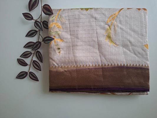Saree with floral patterns on a light gray background