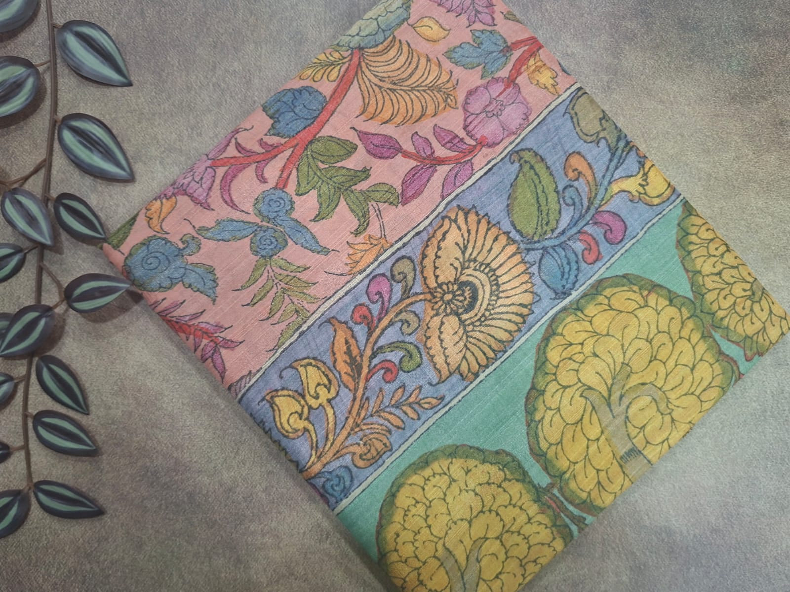 Colorful fabric with floral patterns on a textured surface