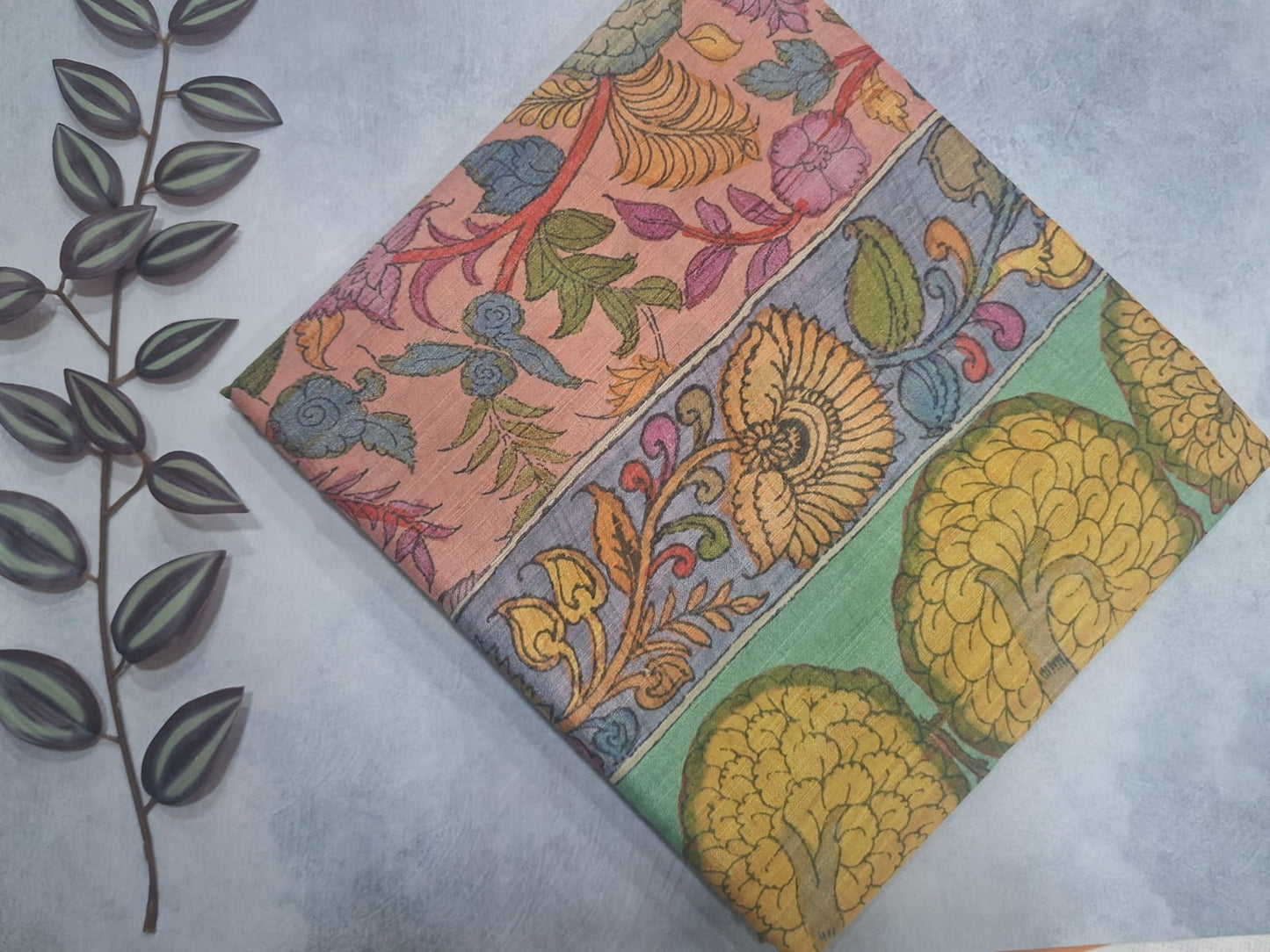 Colorful floral patterned fabric on a light gray background