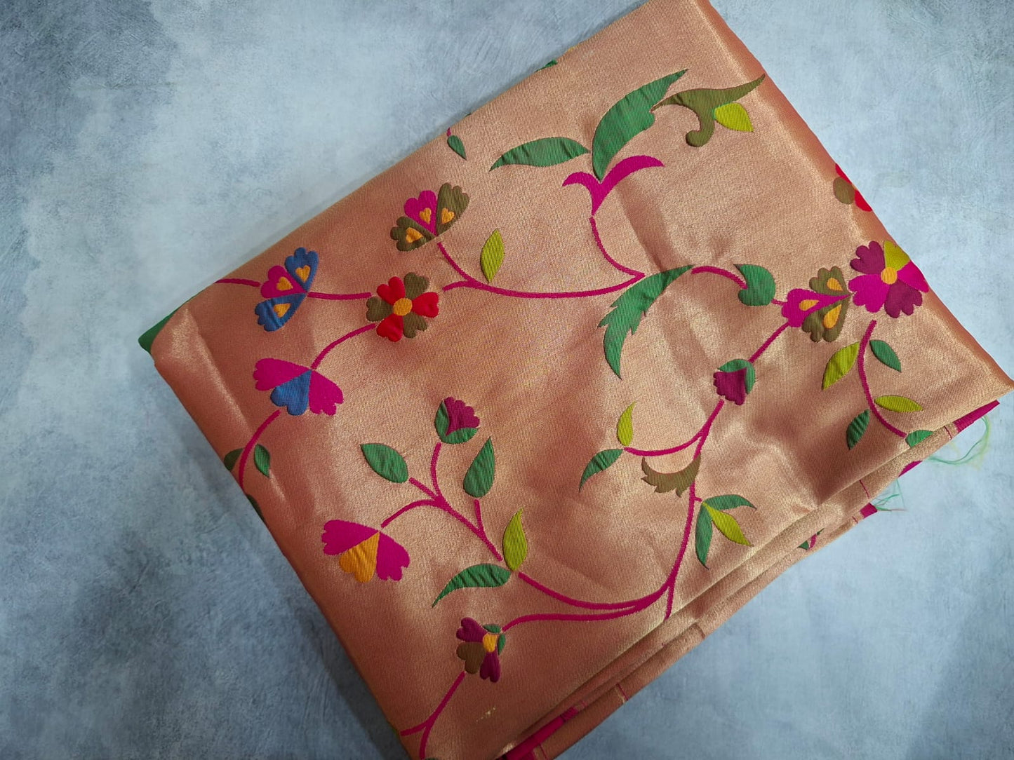 Decorative fabric with colorful floral patterns on a gray background