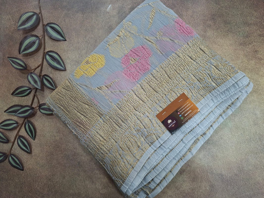 Textured blanket with colorful patterns on a textured surface