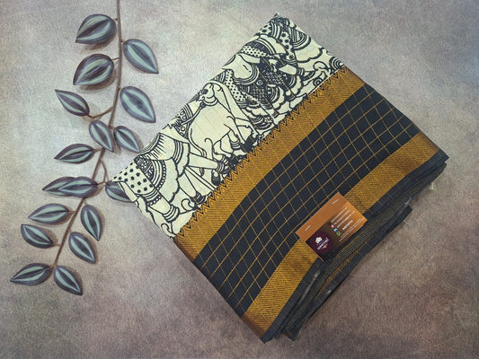 Folded fabric with elephant design and grid pattern on a textured surface with leaves.