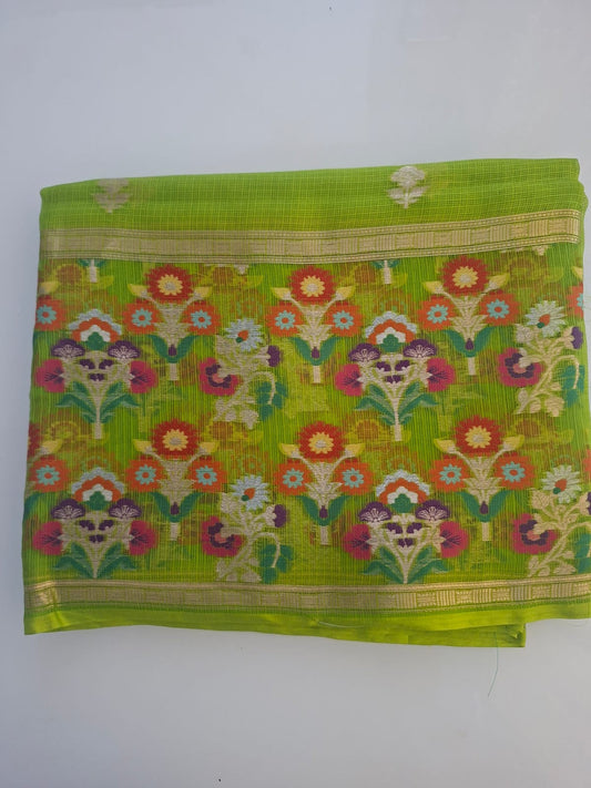 Green saree with floral patterns on a white background