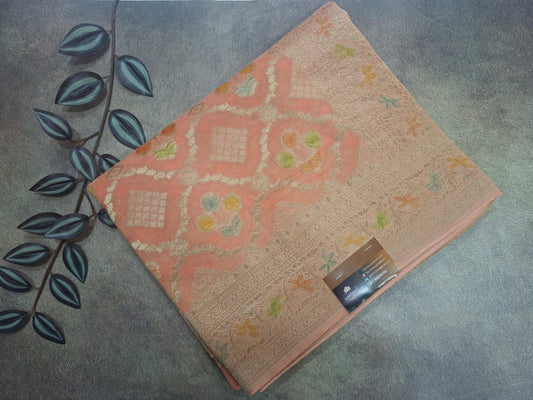 Decorative pink mat with floral patterns on a textured surface