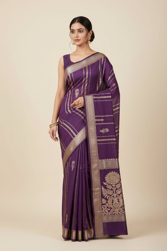 Purple fabric with gold and white floral embroidery on a white background