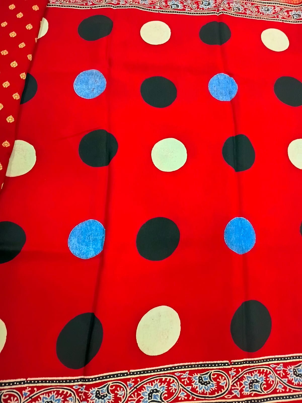 red modal silk circle print saree