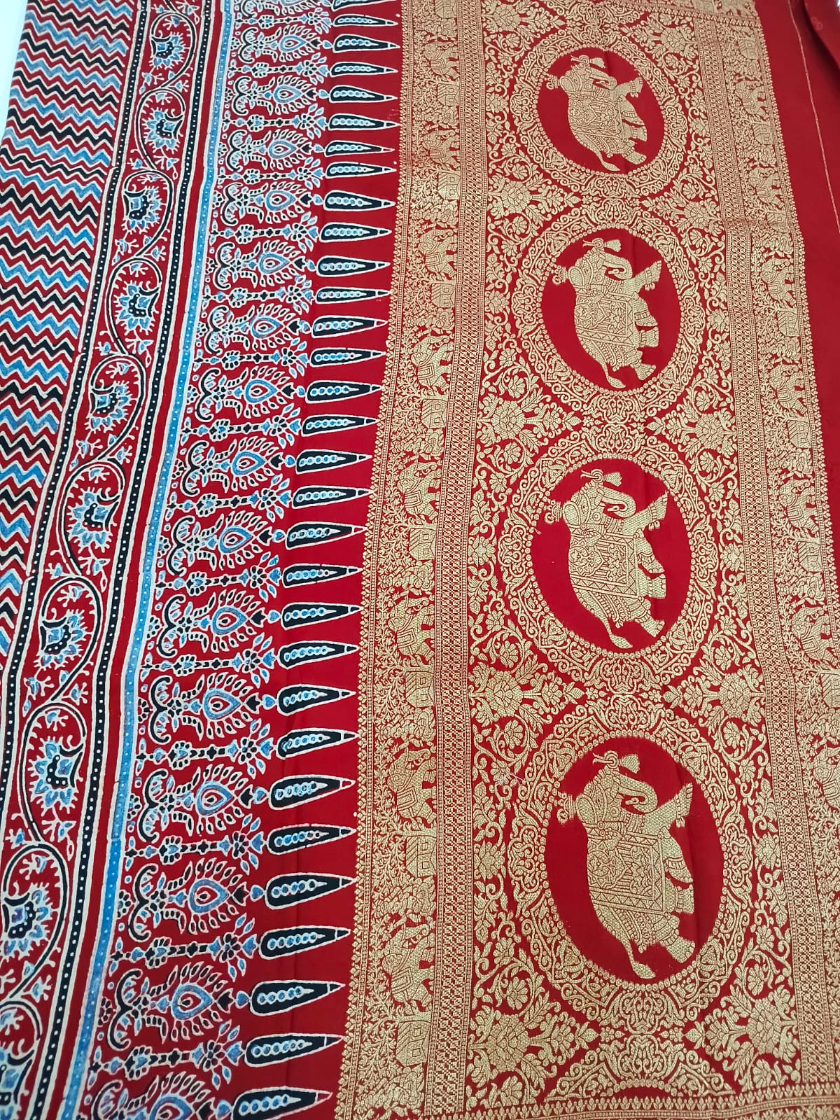 red modal silk circle print saree