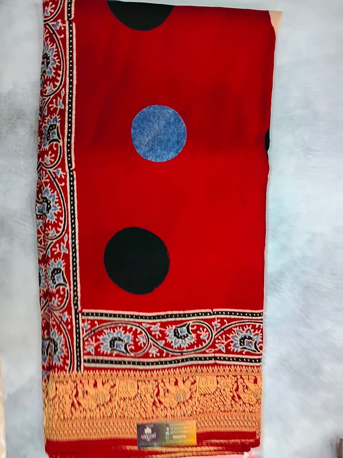 red modal silk circle print saree