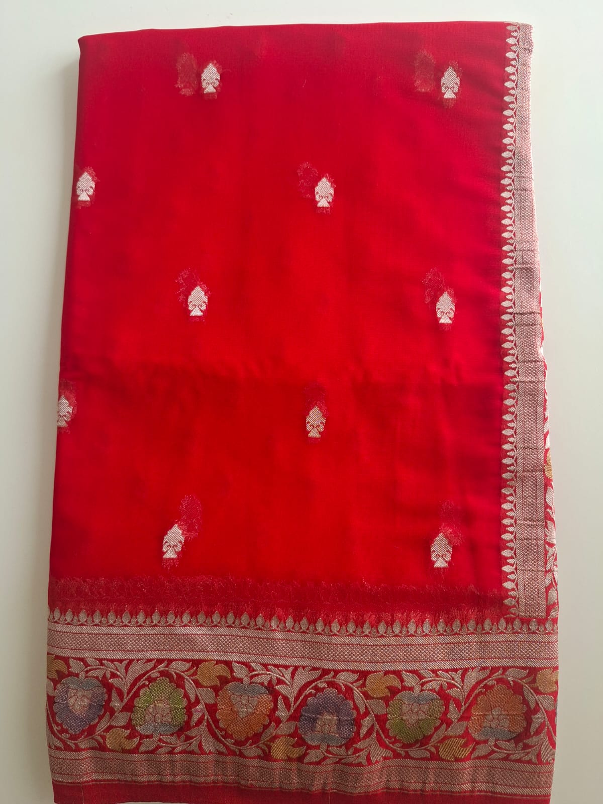 red semi chiffon meenakari border saree