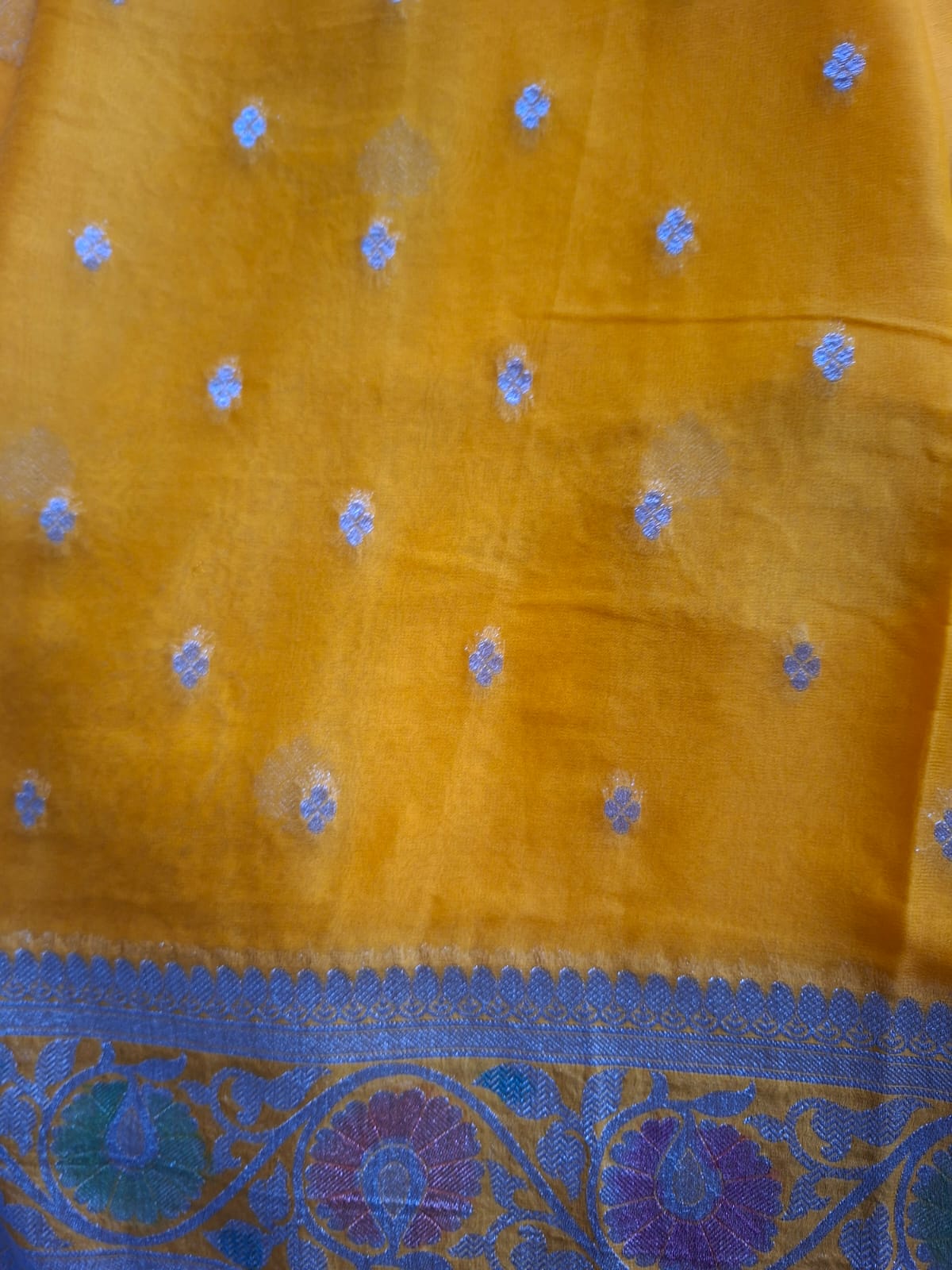 yellow semi chiffon meenakari border saree
