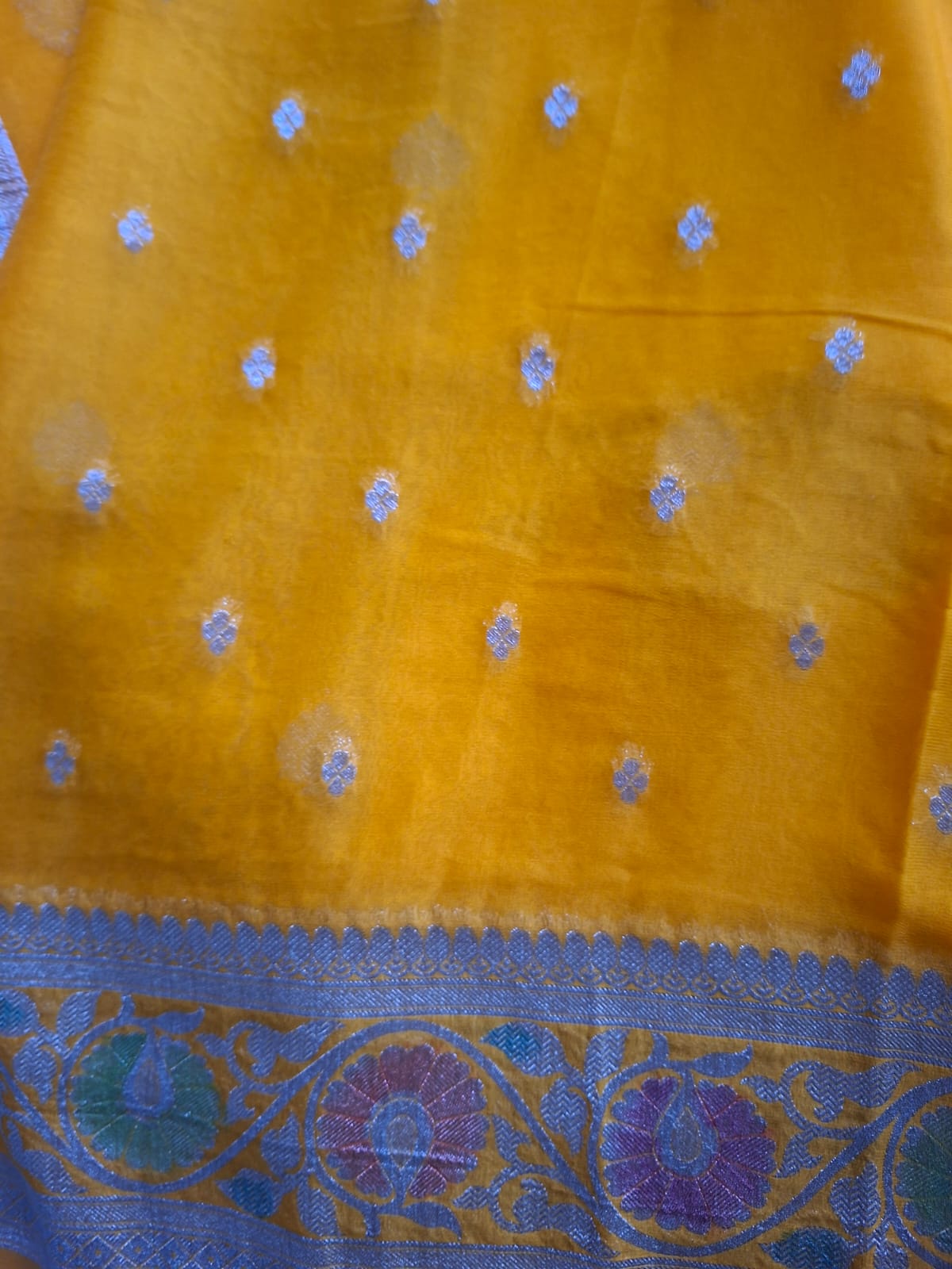 yellow semi chiffon meenakari border saree